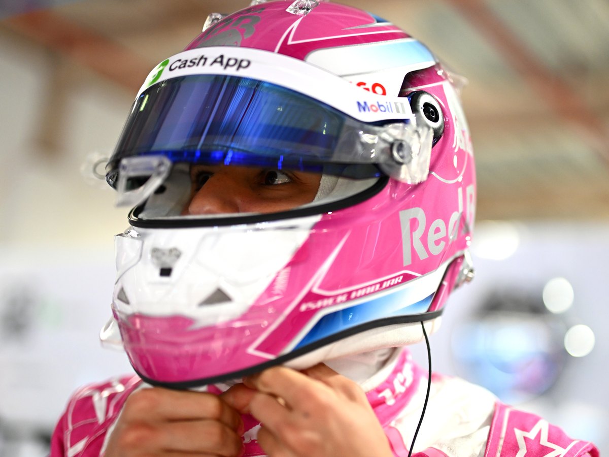 Photo of the Isack Hadjar Racing Bulls pink livery helmet, Miami Grand Prix 2025